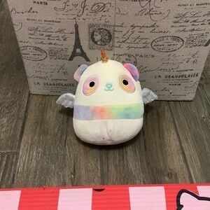 A winged rainbow panda squish mellow